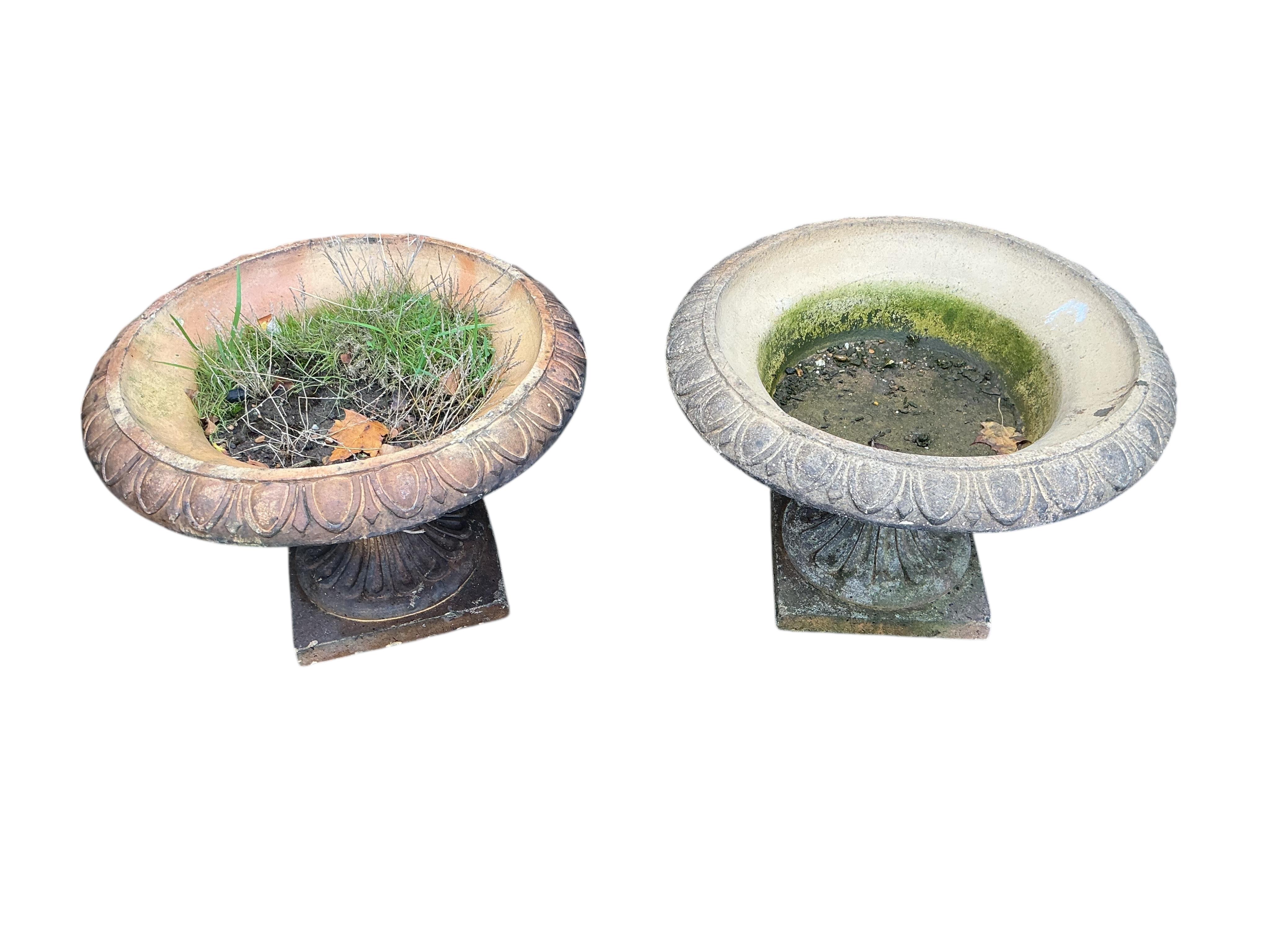 A pair of earthenware campana garden urns, diameter 54cm, height 37cm